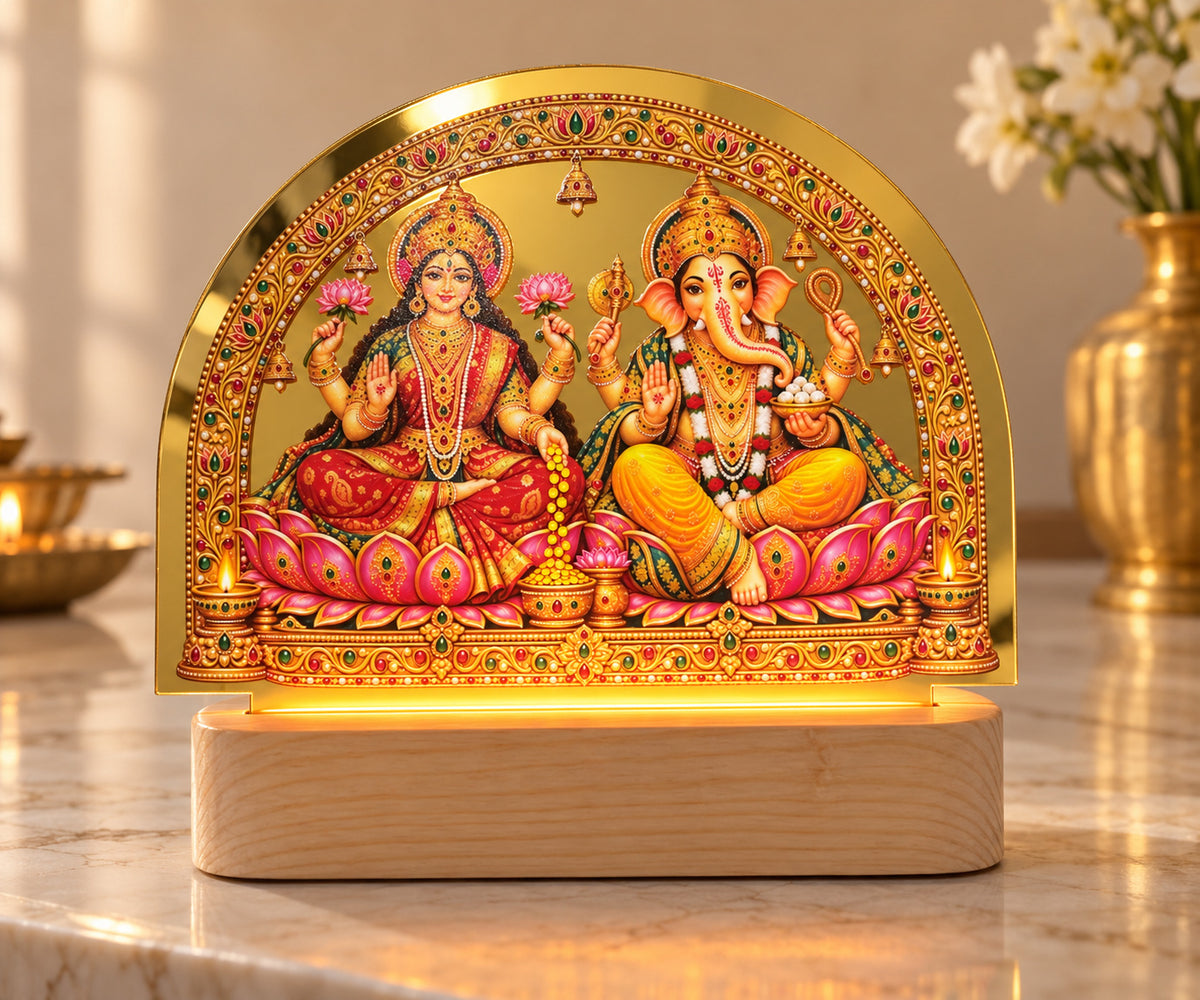 Lakshmi and Ganesh LED tabletop light with an ornate gold-toned arch and illuminated base